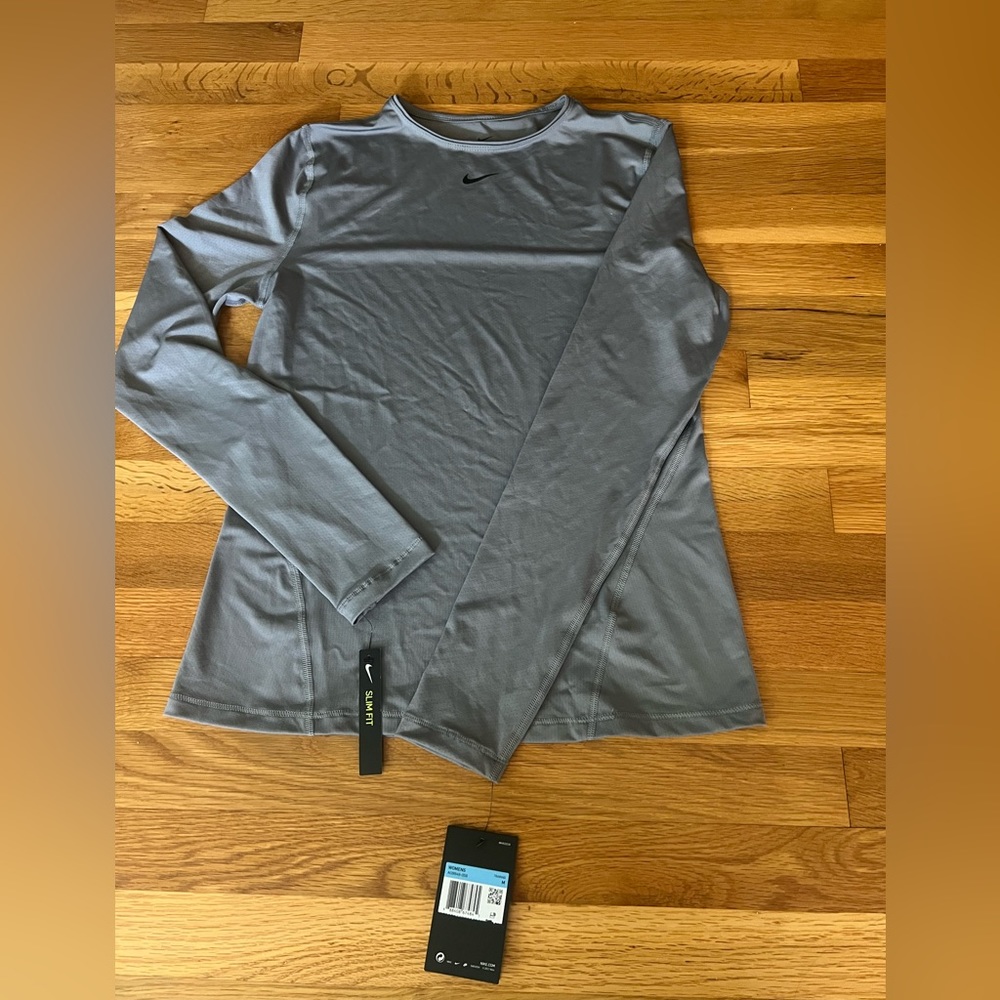 Nike Dri Fit long sleeve base layer. Woman’s size Medium. Slim fit.